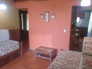 En eller flere senge i et værelse på Cabaña TayiMapu