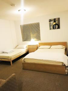 Ένα ή περισσότερα κρεβάτια σε δωμάτιο στο Family Suite