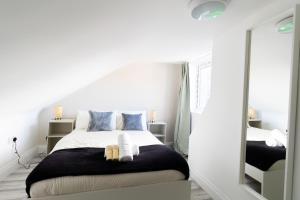 a white bedroom with a bed and a mirror at The Albion Hotel in Hull +48 photos