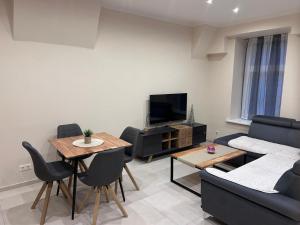 a living room with a couch and a table at Apartment P&T 