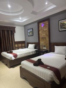 Ένα ή περισσότερα κρεβάτια σε δωμάτιο στο Velora residency