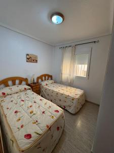 Postel nebo postele na pokoji v ubytování Coral