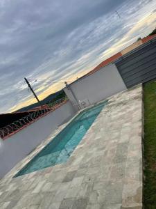 Bazén v ubytování Cultura Viagens Home nebo v jeho okolí