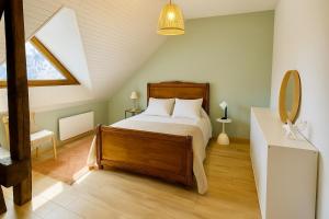 En eller flere senge i et værelse på Maison de montagne, charme alpin & cheminée