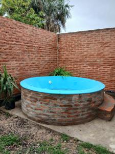 a hot tub in a brick wall at Tuly in Formosa