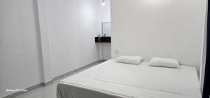 Postel nebo postele na pokoji v ubytování Villa white pepper bibile