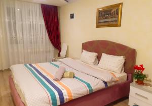 Postel nebo postele na pokoji v ubytování Lachis@ Chisinau