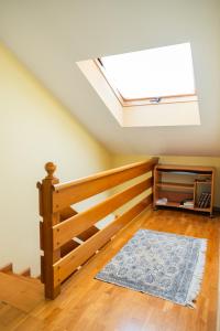 a skylight in a room with a bed and a rug at Asturica in Astorga +8 photos