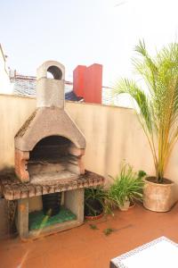 an outdoor pizza oven sitting on a patio at Asturica in Astorga