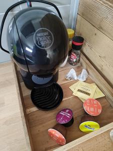 a coffee maker sitting on top of a wooden box at Mechanical cottage, old cars and bikes in Charmes