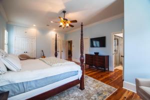 a bedroom with a bed and a ceiling fan at Misty Lane in Edisto Island