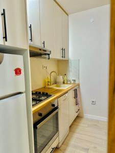 Kuchyň nebo kuchyňský kout v ubytování Modern & Cozy apartment in center -Walk everywhere