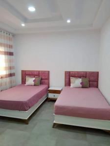 Postel nebo postele na pokoji v ubytování Dar zoghlami