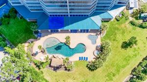 an overhead view of a building with a swimming pool at Beachview Condo at Beau View - 303 - fully furnished 3 bedroom 3 bathroom in De Buys
