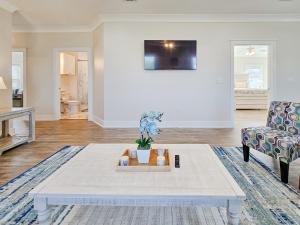 a living room with a coffee table and a couch at Brand New Home with Beach Views! Fully furnished 3 bedroom home in Gulfport in Gulfport
