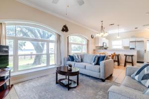 a living room with a couch and a table at 120 Beau Clair - Beachview Townhome with Balcony and Deck in Long Beach in Long Beach