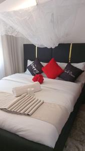 Ένα ή περισσότερα κρεβάτια σε δωμάτιο στο Budget bliss3 bnb Ruaka +19 φωτογραφίες