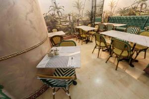 a restaurant with tables and chairs and tables and tablesktop at Hostal Sol in Toledo