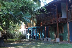 an outside view of a building with a tree at Brisas del Caribe 3 in Tapantí