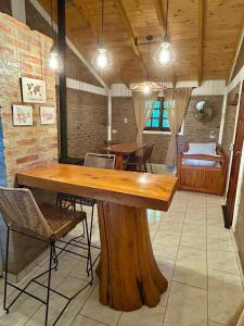 a large wooden table in a room with chairs at Atrapa Sueños I in Embalse