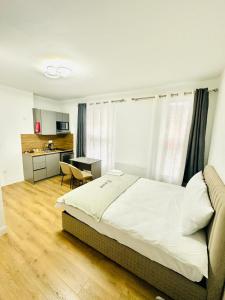 Ένα ή περισσότερα κρεβάτια σε δωμάτιο στο Nottingham Forest The City Ground Studio Apartments