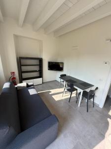 a living room with a table and a couch at Riverwell in Sesto Calende