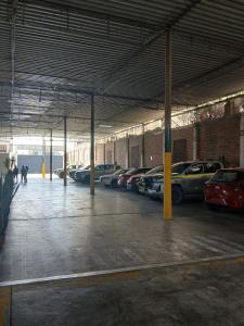 a parking garage with cars parked in it at Casa Grau Chincha in Chincha