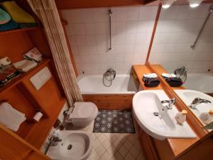 a bathroom with a sink and a toilet and a tub at "FamilyNest" by Staymarilleva1400 in Marilleva +13 photos