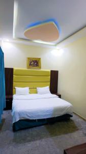 Ένα ή περισσότερα κρεβάτια σε δωμάτιο στο منتجع سيني لاند 3