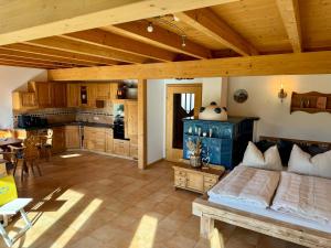 a large room with a bed and a kitchen at Gipfelruhe Ramsau am Dachstein in Ramsau am Dachstein