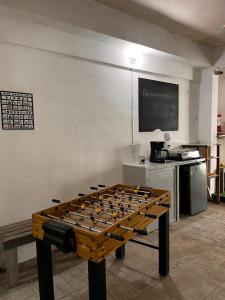 a large chess board on a table in a room at Nómadas Hostel in La Paz