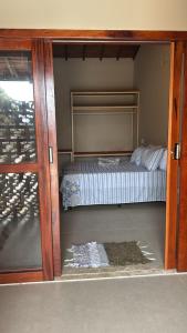 a bedroom with a bunk bed in a room at Pousada Green House Paraty in Paraty +2 photos