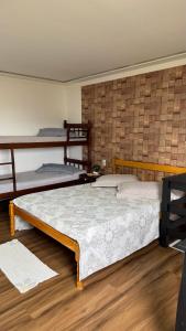 Ένα ή περισσότερα κρεβάτια σε δωμάτιο στο Hospedagem 3 Estrelas +57 φωτογραφίες