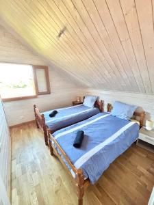 Ένα ή περισσότερα κρεβάτια σε δωμάτιο στο Chalet Doux Refuge - 1 à 6 personnes - Plaine des Palmistes