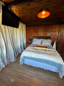 Ένα ή περισσότερα κρεβάτια σε δωμάτιο στο Cabana Odara