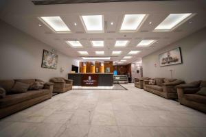 a living room with couches and a lobby at Afaq Taiba Hotel in Medina