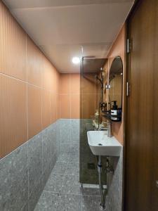 a bathroom with a sink and a mirror at 스테이 마루 종로 Stay Maru Jongno in Seoul