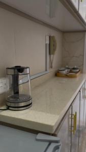 a blender sitting on a counter in a kitchen at Apartment in Tabuk