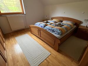 a bedroom with a bed with two teddy bears on it at Pr Fajfarju in Spodnja Sorica