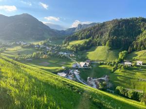 an aerial view of a village in the mountains at Pr Fajfarju in Spodnja Sorica