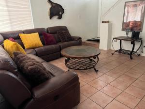 a living room with a couch and a coffee table at The Bobcat in San Marcos