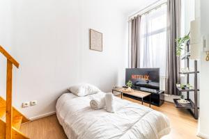 TV a/nebo společenská místnost v ubytování Le MEZZA - Wifi - Netflix - Centre Ville - Métro - Tram