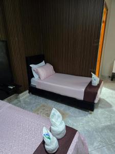 Ένα ή περισσότερα κρεβάτια σε δωμάτιο στο Hôtel ikrams