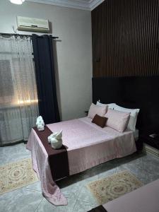 Ένα ή περισσότερα κρεβάτια σε δωμάτιο στο Hôtel ikrams