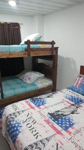 Ένα ή περισσότερα κρεβάτια σε δωμάτιο στο Hotel gran acapulco M&A