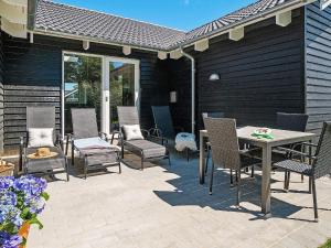 a patio with chairs and a table on a patio at 5 star holiday home in Kappeln in Kappeln