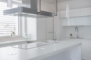 a white kitchen with a sink and aaucet at SWEETHOME TALVERA - con Garage in Bolzano