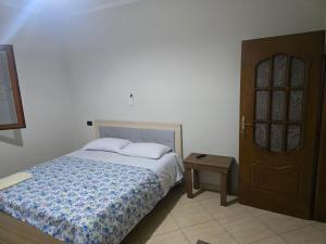 Ένα ή περισσότερα κρεβάτια σε δωμάτιο στο Grand Rooms