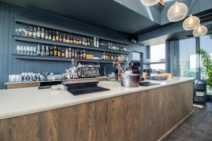 a bar in a restaurant with a view at 423 Menlyn maine Apartment in Pretoria