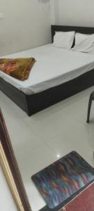 Voodi või voodid majutusasutuse Kashi kedar paying guest house toas